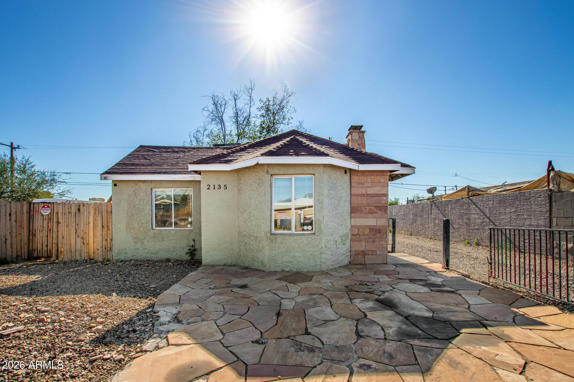 a view of a house with a backyard
