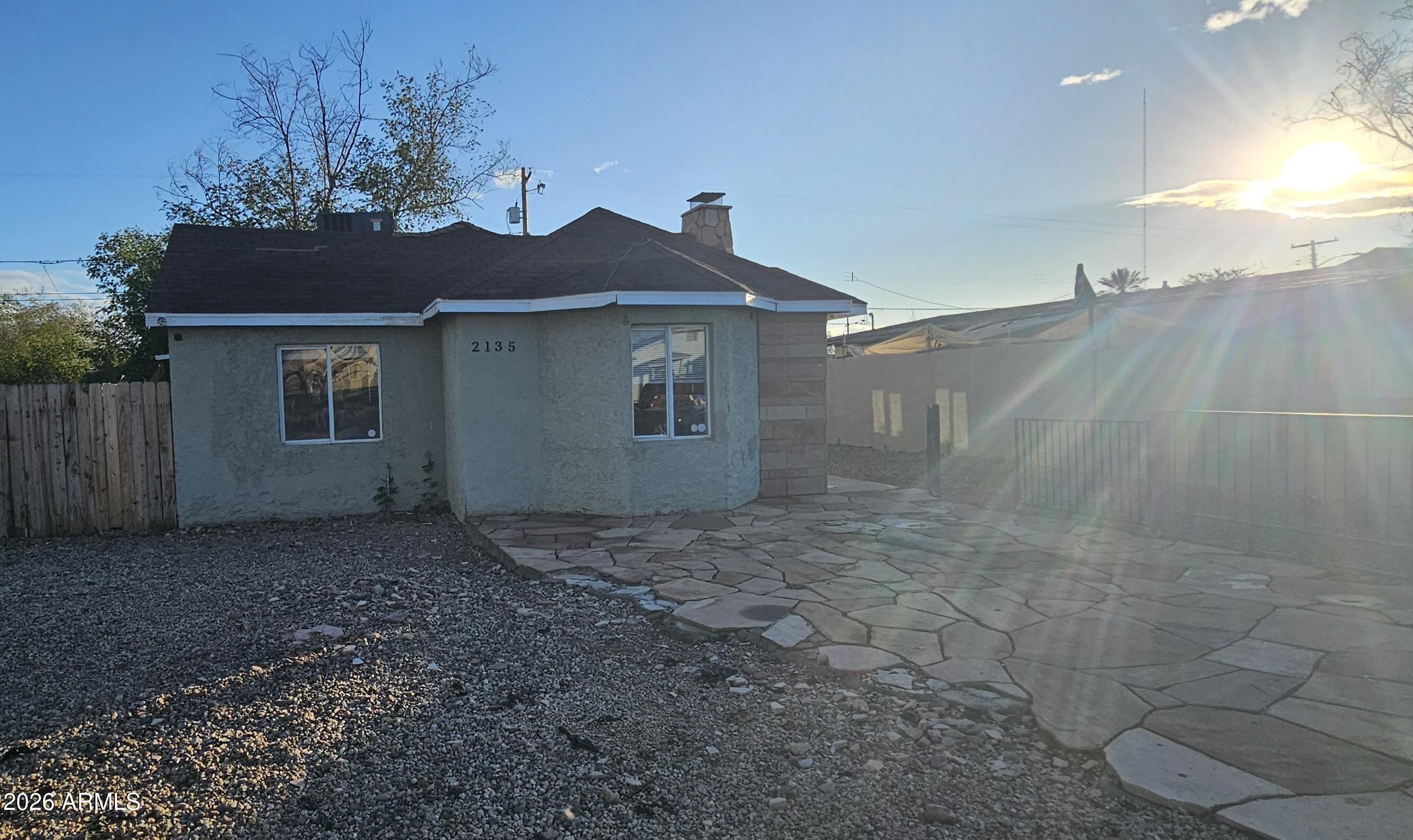2135 West Hadley Street, Unit 1 Phoenix, AZ 85009 - Photo 16 of 18 a view of a house with a yard