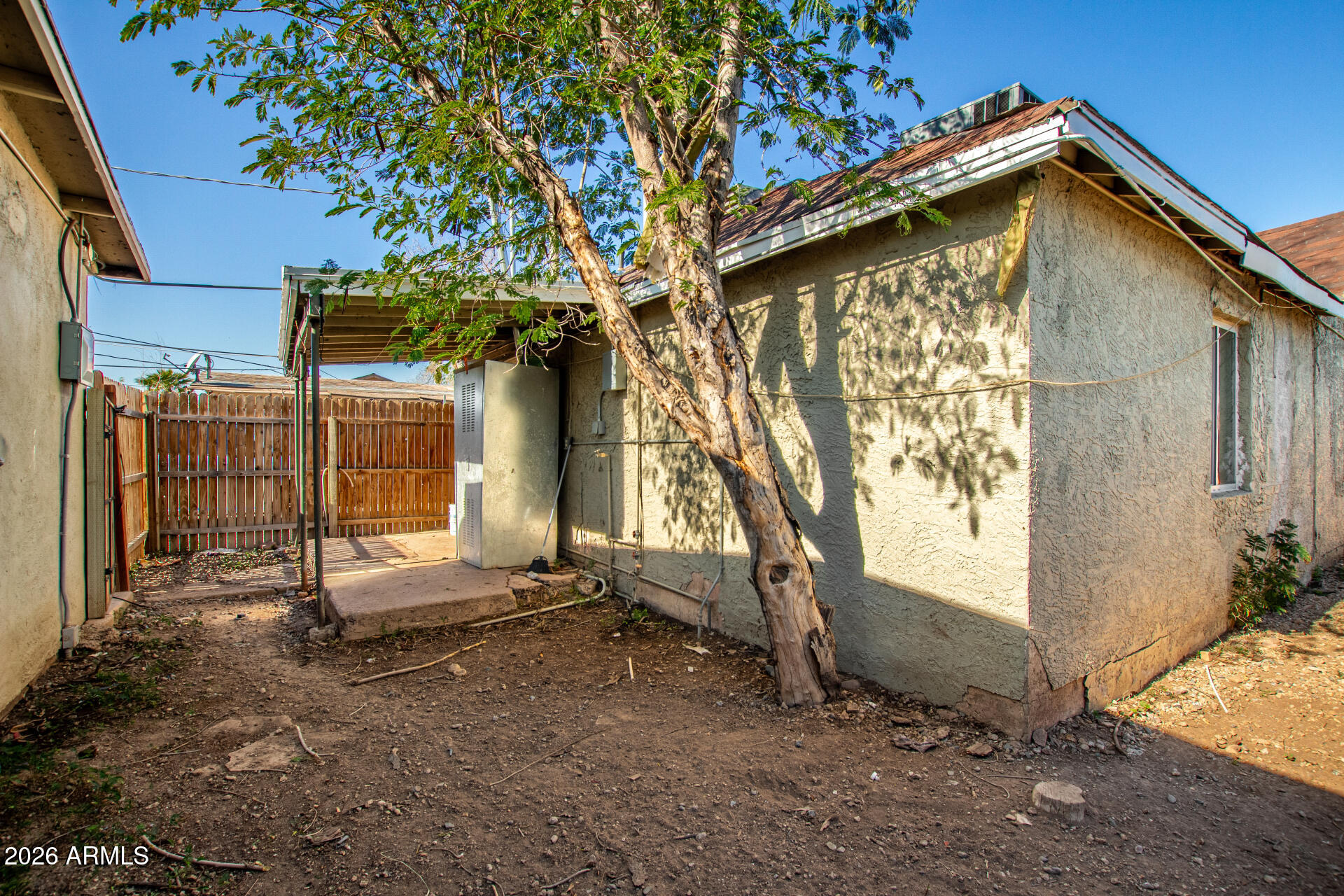 2135 West Hadley Street, Unit 1 Phoenix, AZ 85009 - Photo 18 of 18 a view of a house with a tree