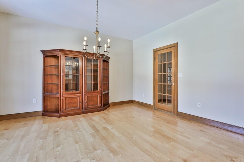 9 Woodside Road Harvard, MA 01451 - Photo 5 of 42 an empty room with wooden floor a ceiling fan and windows
