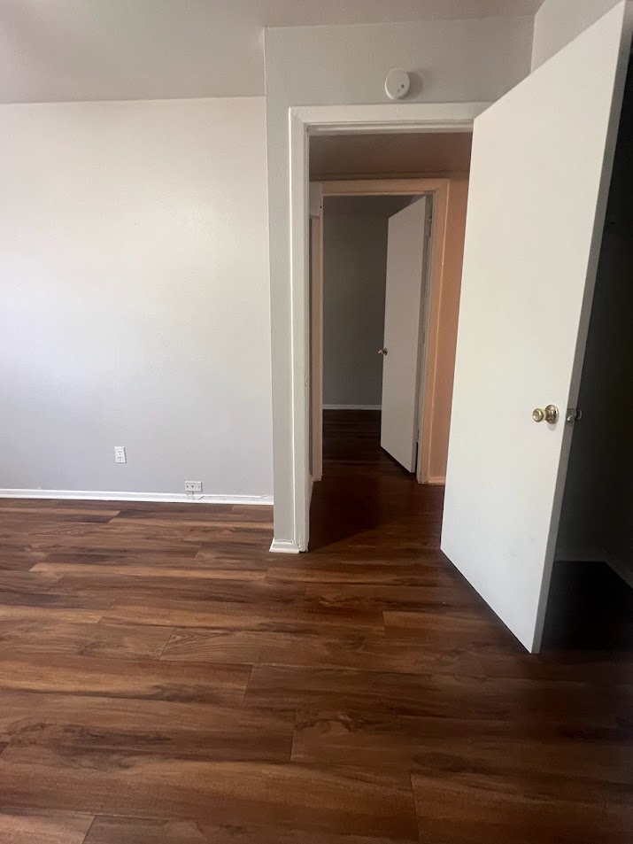 307 East 31st Street, Unit 102 Austin, TX 78705 - Photo 14 of 16 a view of room with wooden floor