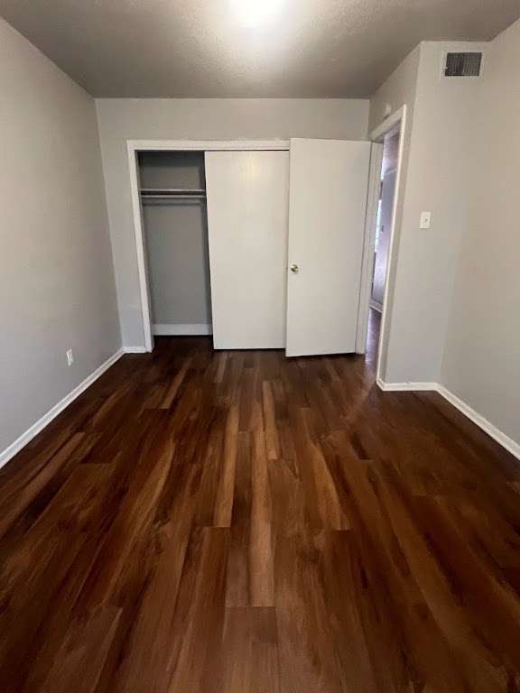 307 East 31st Street, Unit 102 Austin, TX 78705 - Photo 16 of 16 a view of an empty room with wooden floor