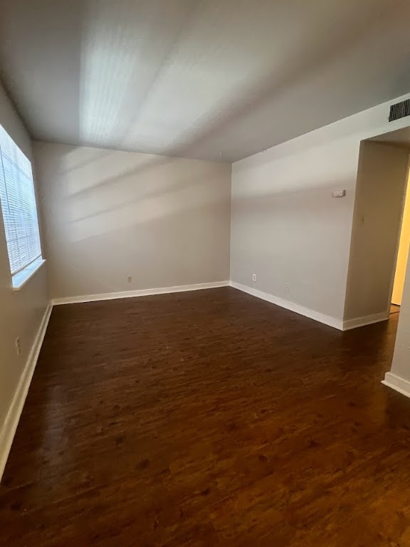 307 East 31st Street, Unit 102 Austin, TX 78705 - Photo 3 of 16 an empty room with wooden floor and windows