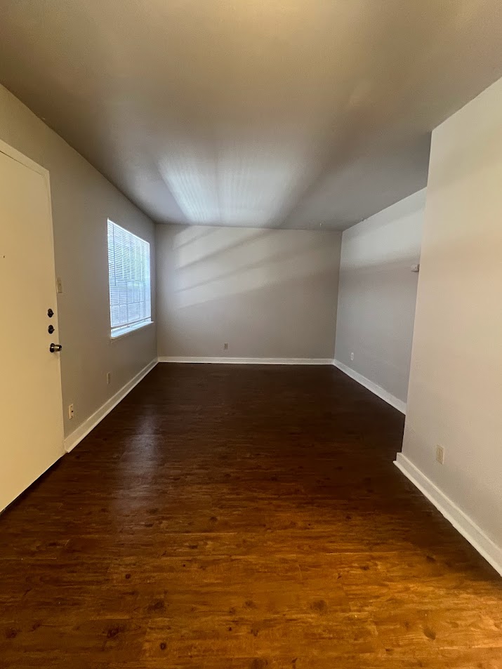 307 East 31st Street, Unit 102 Austin, TX 78705 - Photo 4 of 16 wooden floor in an empty room