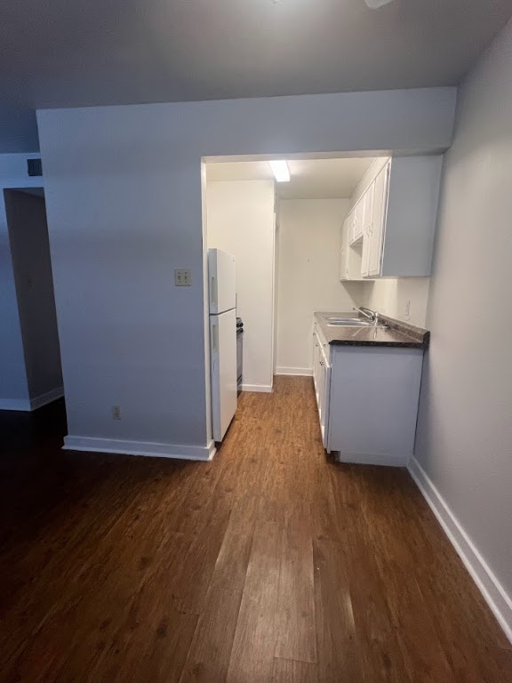 307 East 31st Street, Unit 102 Austin, TX 78705 - Photo 5 of 16 a view of kitchen with wooden floor and electronic appliances