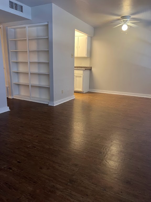 307 East 31st Street, Unit 102 Austin, TX 78705 - Photo 6 of 16 a view of an empty room with a window and wooden floor