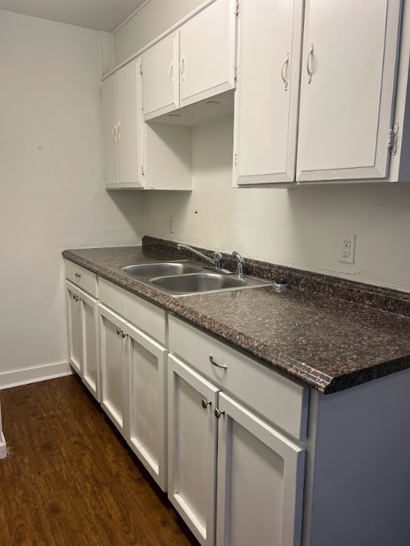 307 East 31st Street, Unit 102 Austin, TX 78705 - Photo 8 of 16 a kitchen with granite countertop white cabinets and a stainless steel appliances