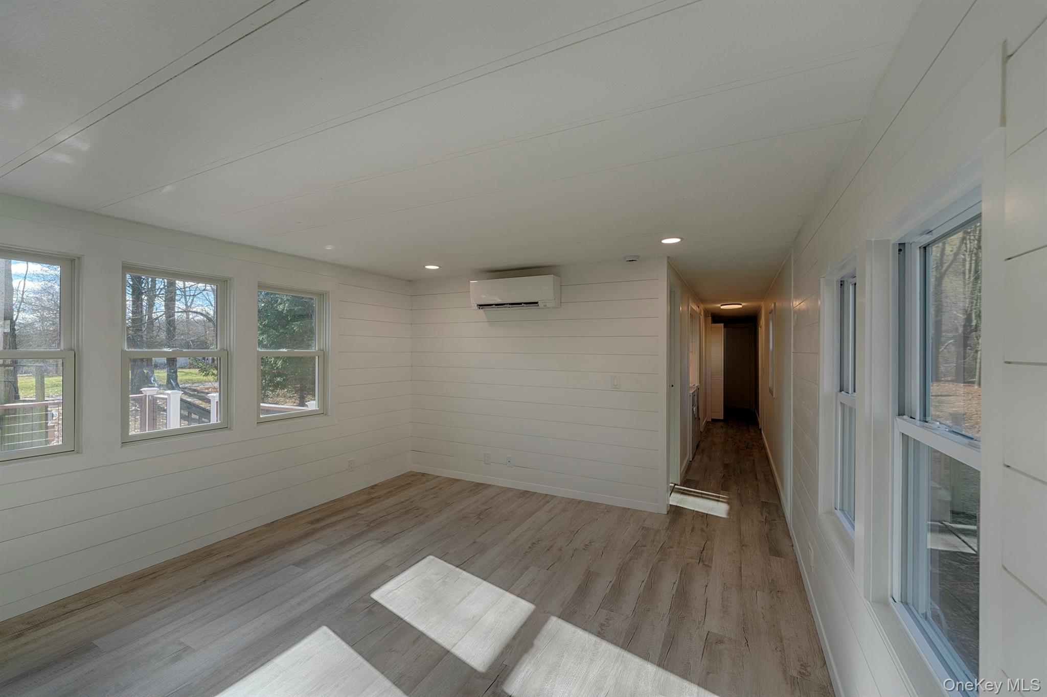 193 Decker Road Stanfordville, NY 12581 - Photo 11 of 34 wooden floor in an empty room with a window