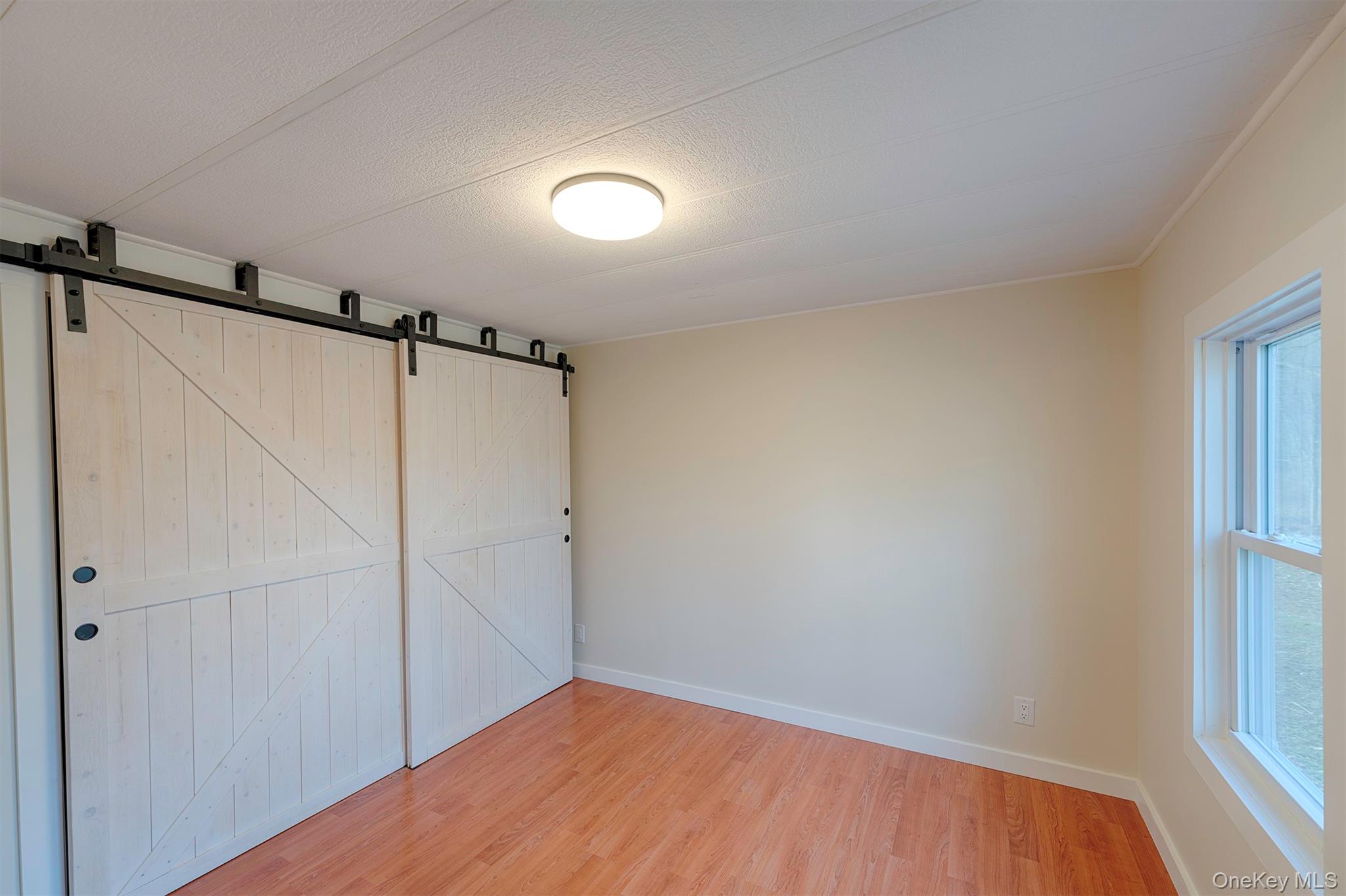 193 Decker Road Stanfordville, NY 12581 - Photo 17 of 34 a view of a room with wooden floor closet and windows