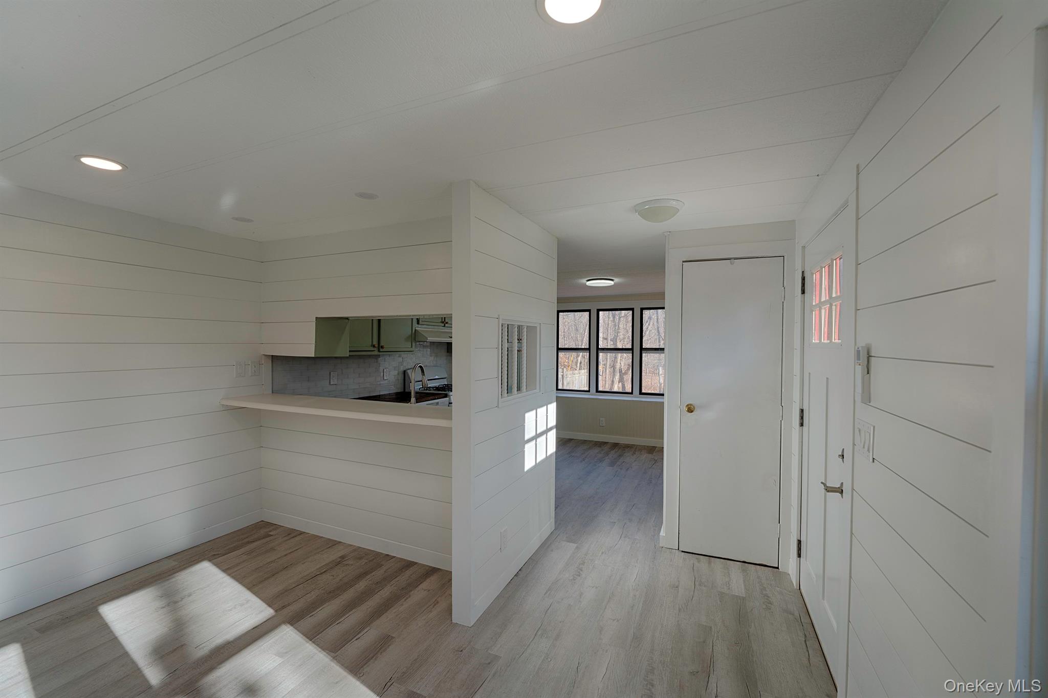 193 Decker Road Stanfordville, NY 12581 - Photo 6 of 34 a view of hallway with wooden floor and a sink