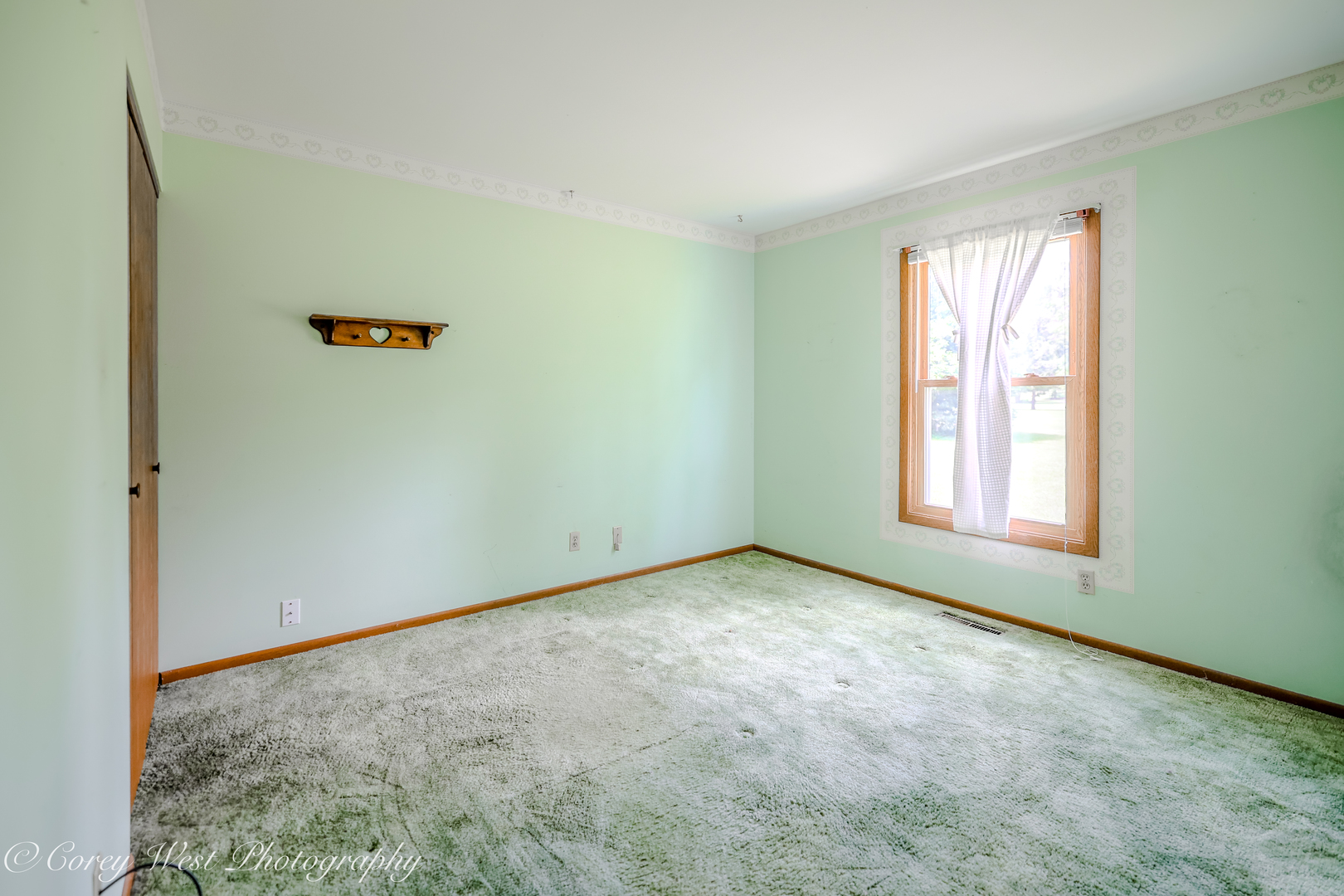 335 South Hadsall Street Genoa, IL 60135 - Photo 12 of 23 an empty room with a window