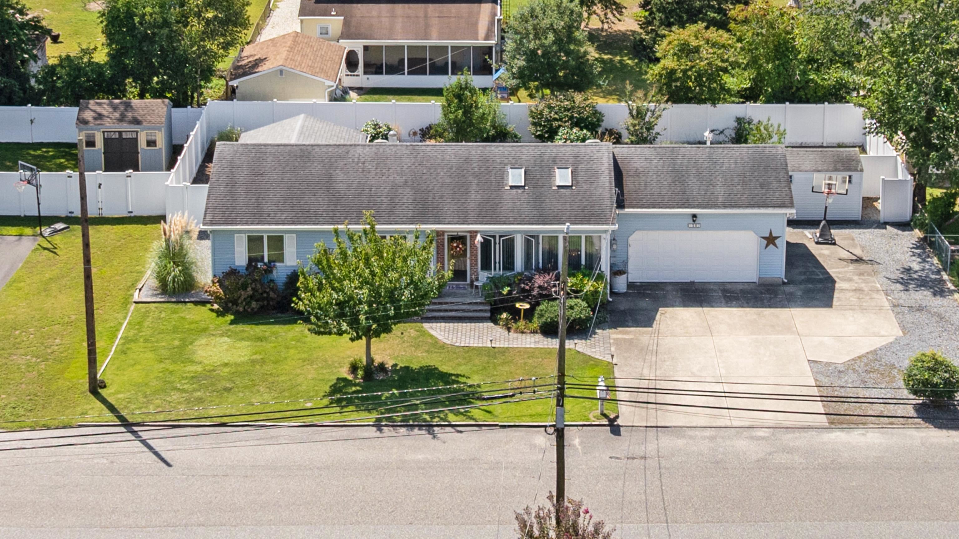 an aerial view of a house with swimming pool