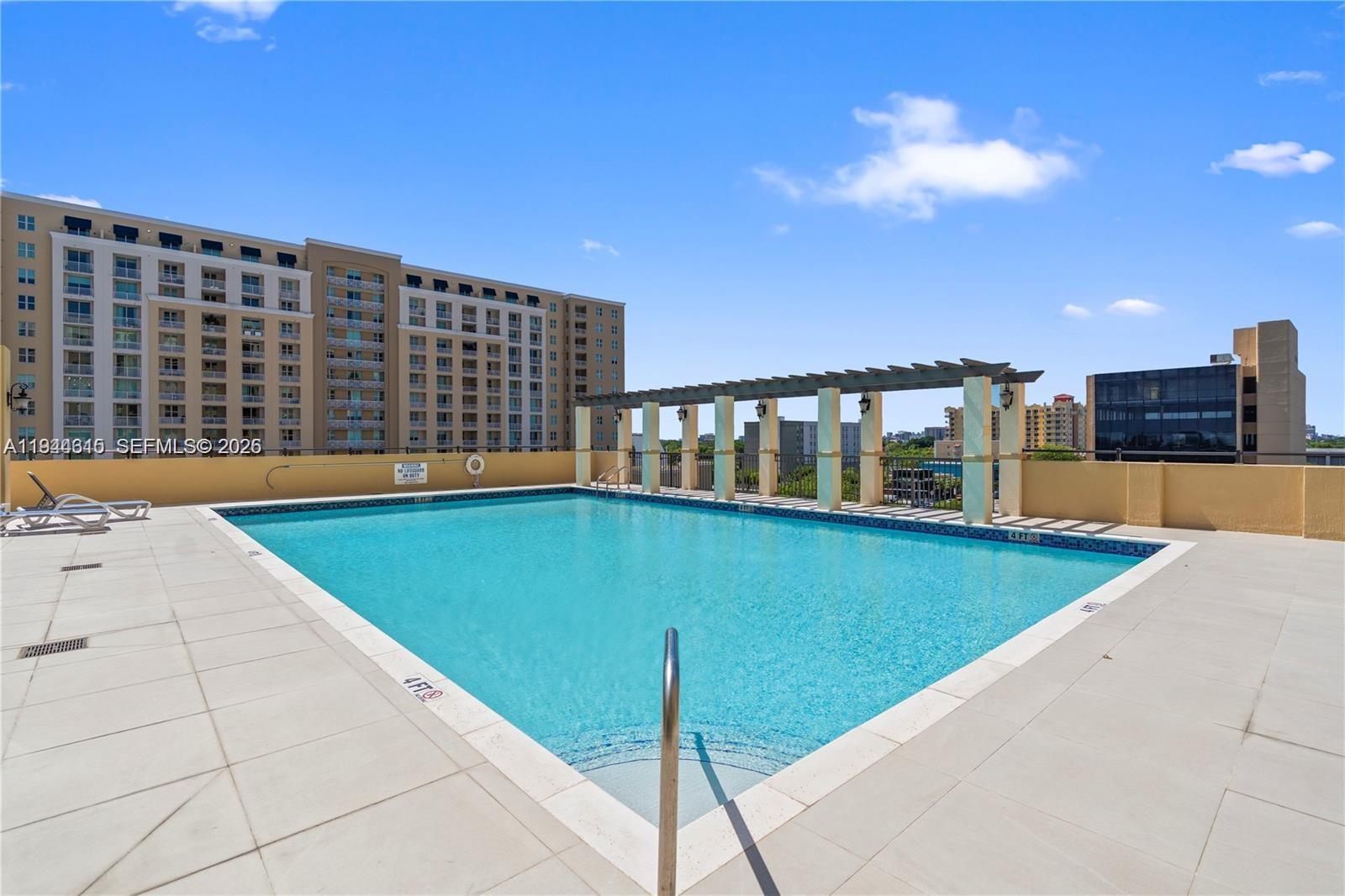 4242 Northwest 2nd Street, Unit 1609 Miami, FL 33126 - Photo 12 of 40 a view of swimming pool with a chairs