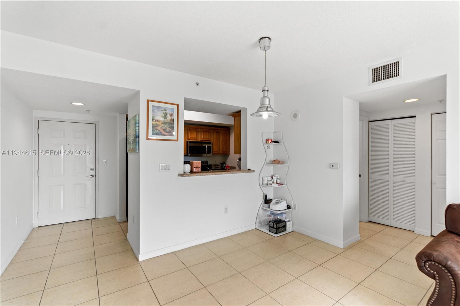 4242 Northwest 2nd Street, Unit 1609 Miami, FL 33126 - Photo 30 of 40 a view of an entryway with wooden floor