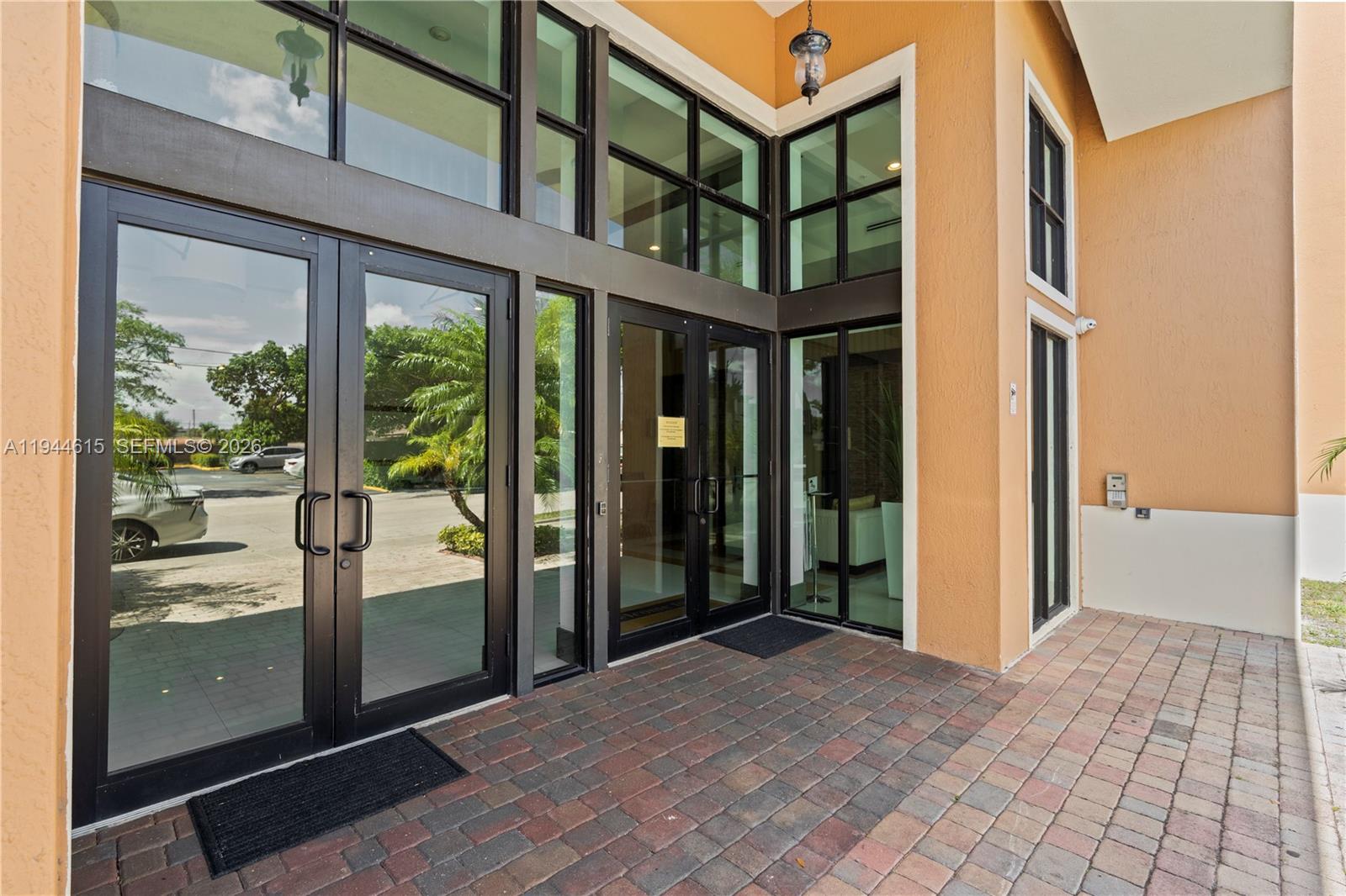 4242 Northwest 2nd Street, Unit 1609 Miami, FL 33126 - Photo 6 of 40 a view of a building from a glass door