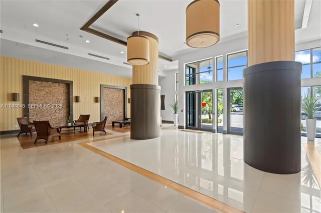 a view of living room with furniture and windows