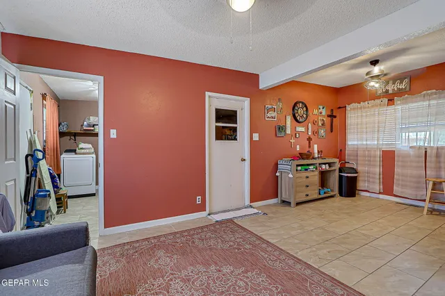 a bedroom with furniture and a flat screen tv