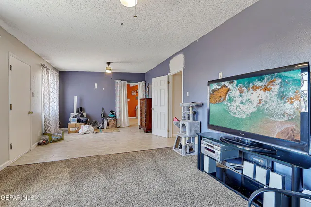 a view of a livingroom with furniture and toys