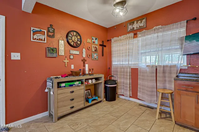 a room with furniture and wall paintings