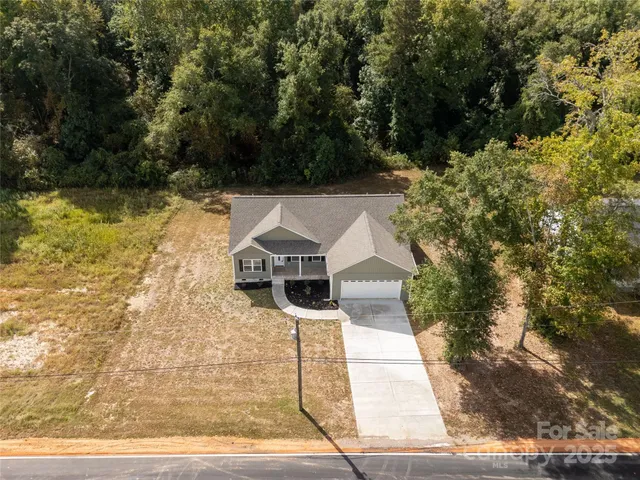 a aerial view of a house with swimming pool
