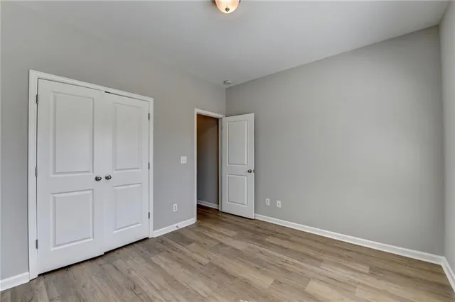 a view of an empty room and closet area