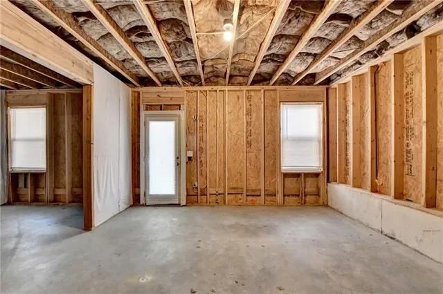 a view of a room with wooden walls