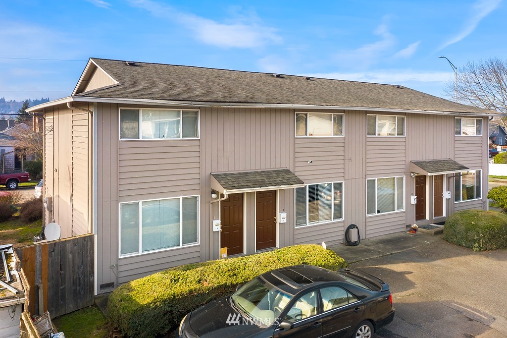 1421 North 3rd Street Renton, WA 98057 - Photo 6 of 17 a front view of a house with a yard