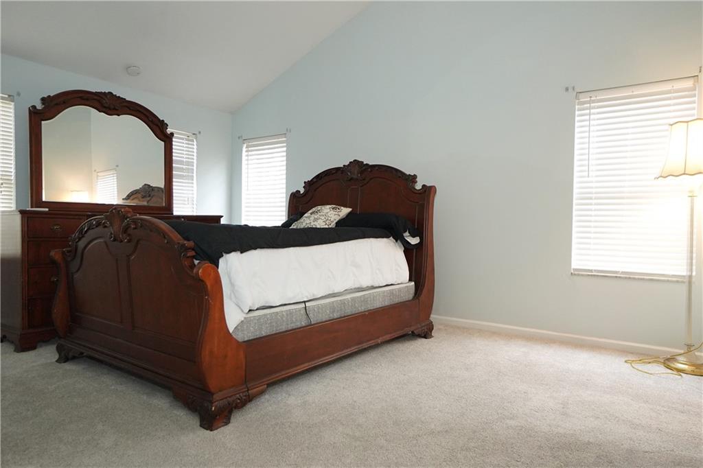 728 Mercer Street Pittsburgh, PA 15219 - Photo 12 of 27 a bedroom with a bed and window