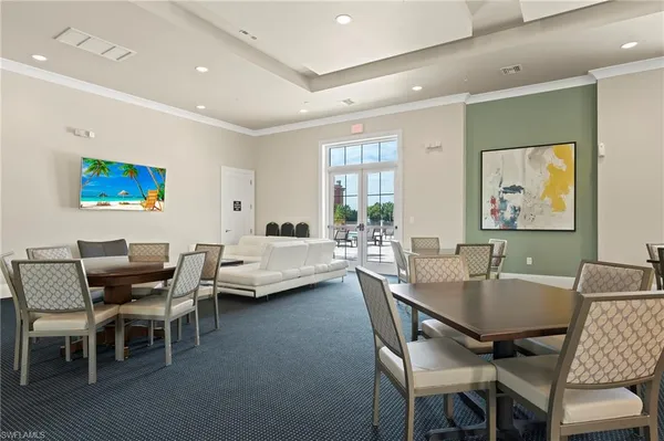 a dining room with furniture and window