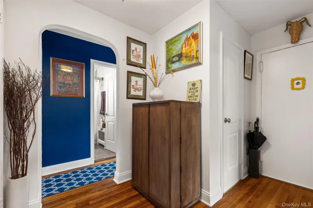 a view of bedroom with a bed and wooden floor