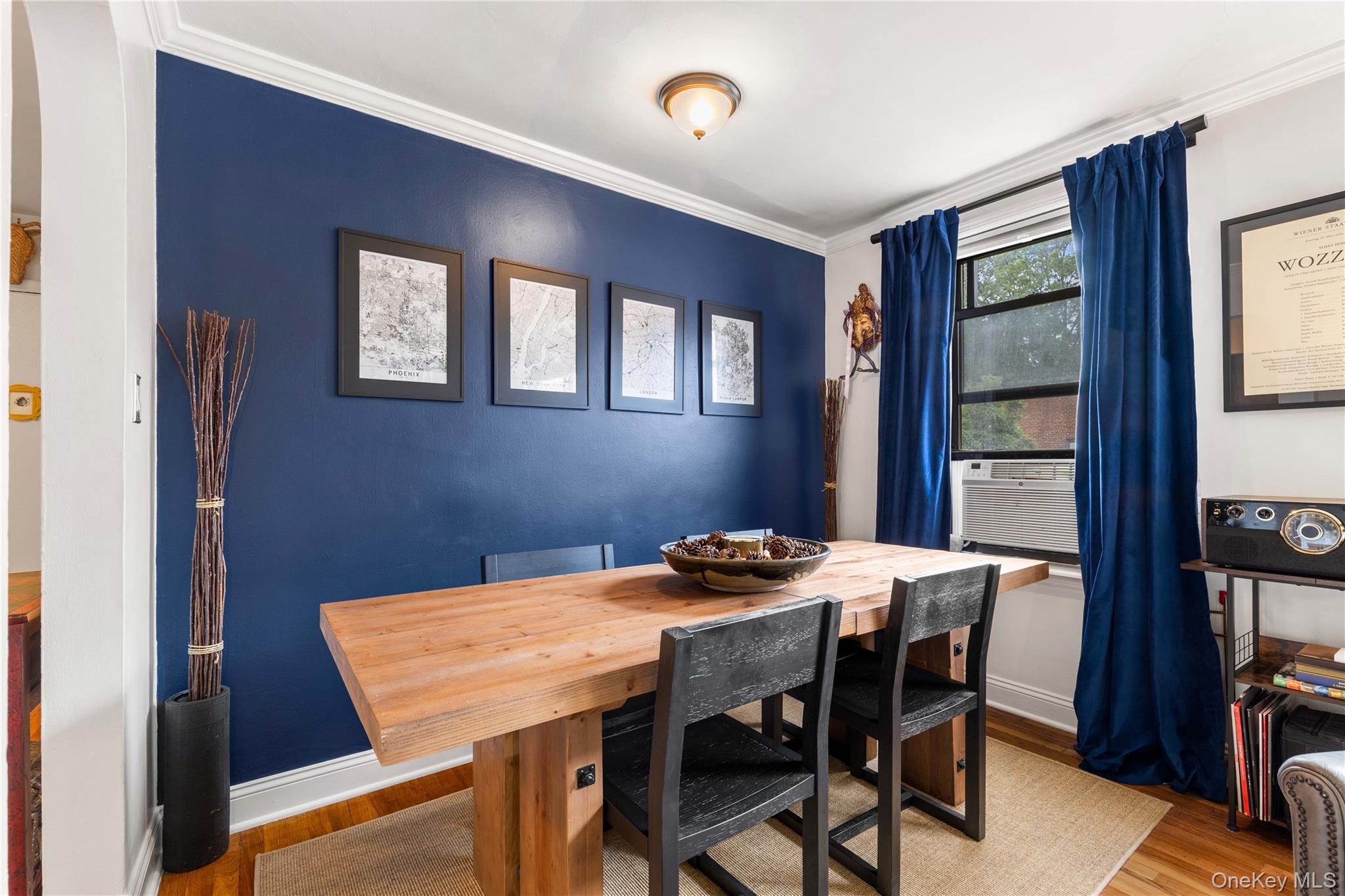 316 Richbell Road, Unit C2 Mamaroneck, NY 10543 - Photo 7 of 13 Cozy dining area featuring wood finished floors, ornamental molding, cooling unit, and baseboards