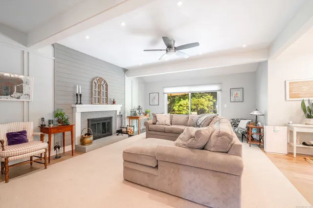 a bedroom with a bed a couch and dresser