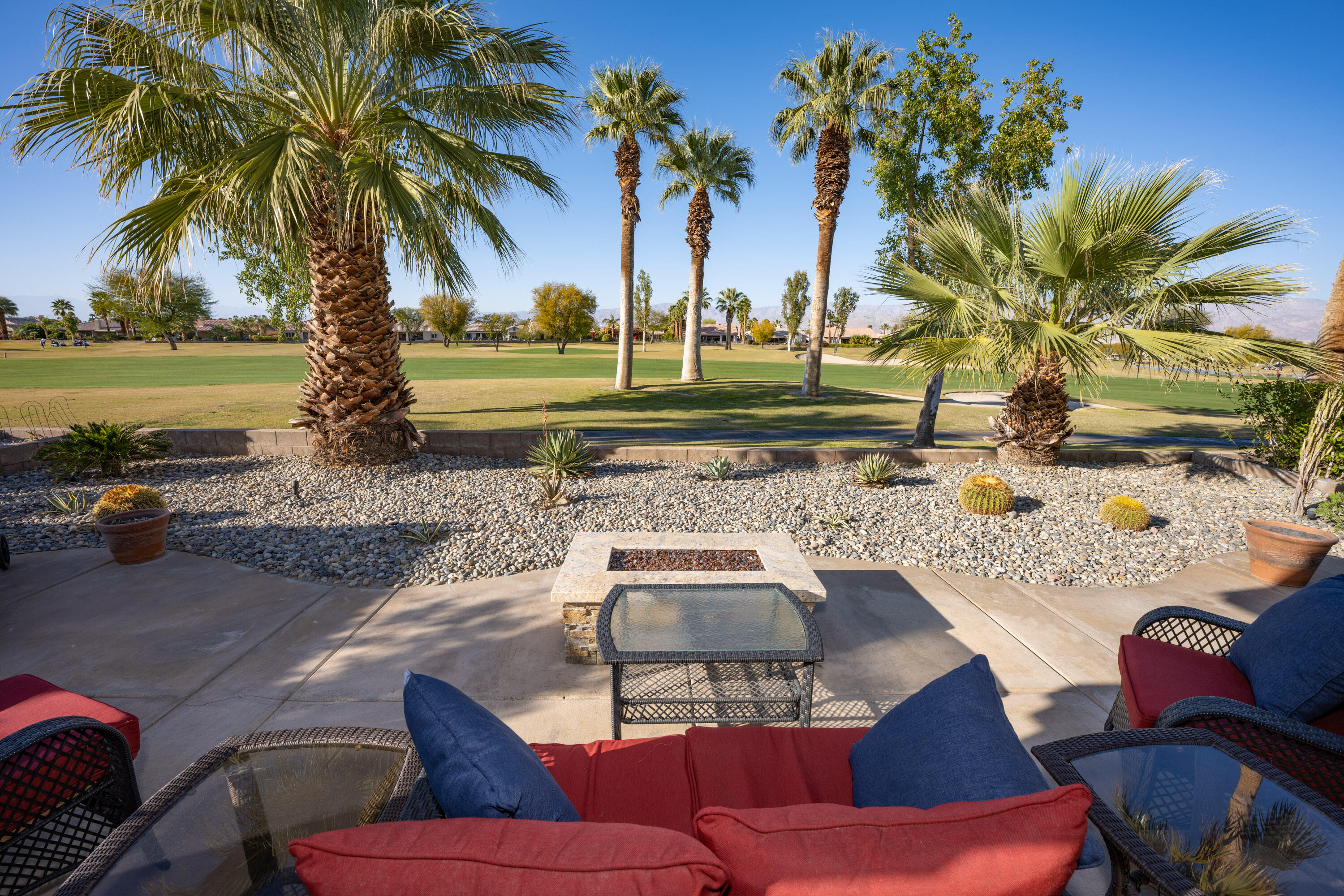 a view of a yard with furniture