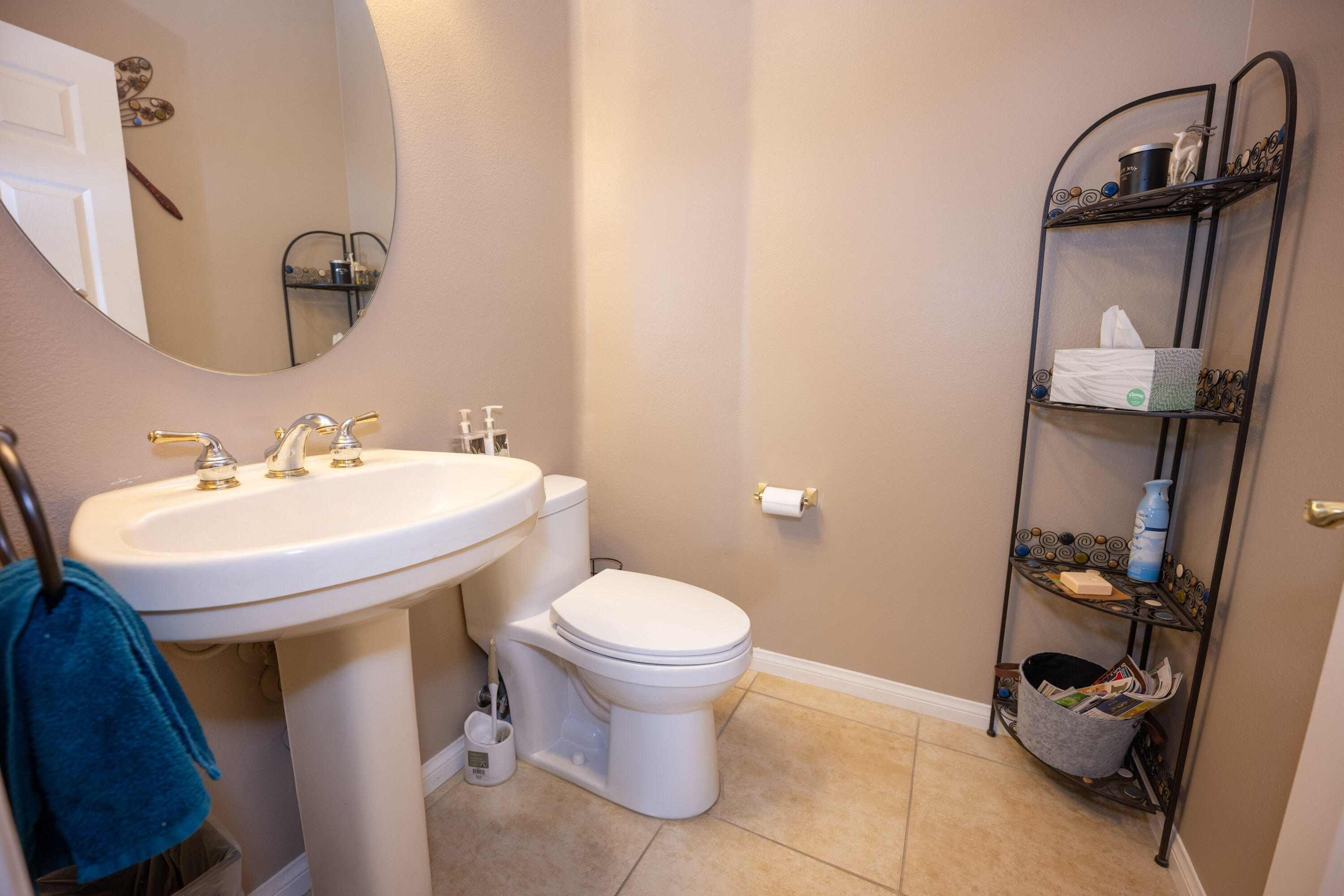 79754 Carmel Valley Avenue Indio, CA 92201 - Photo 13 of 36 a bathroom with a sink toilet and a mirror
