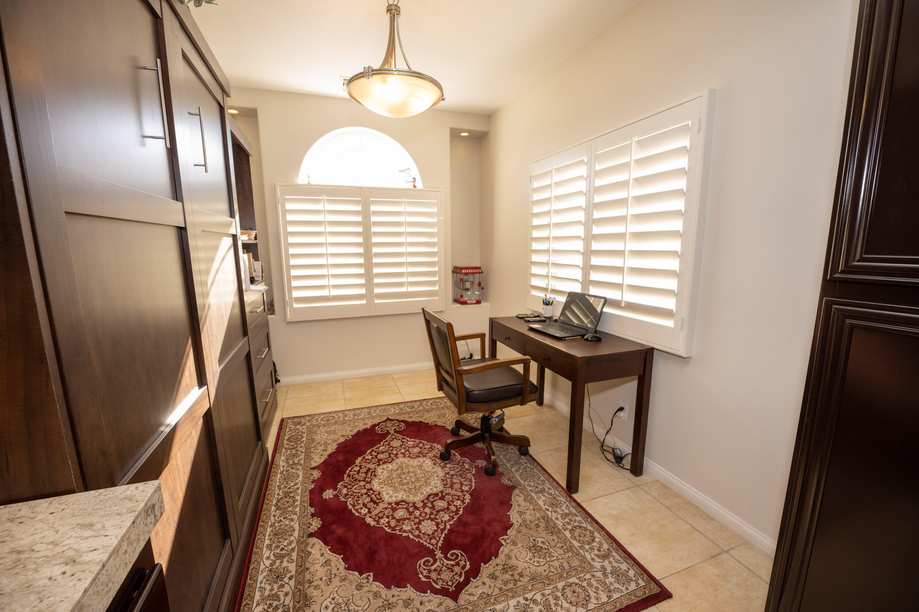 79754 Carmel Valley Avenue Indio, CA 92201 - Photo 15 of 36 a workspace with furniture and a window