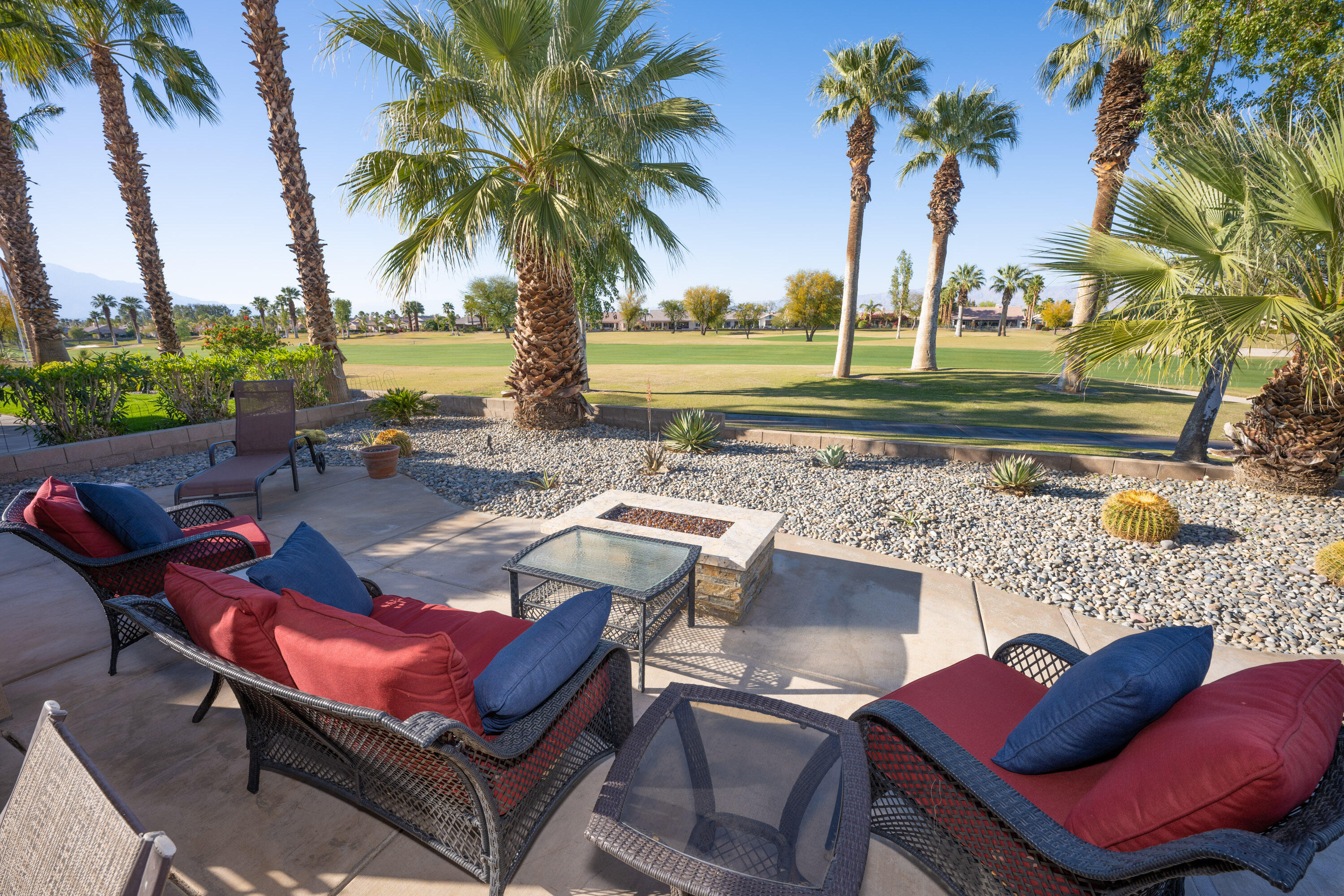 79754 Carmel Valley Avenue Indio, CA 92201 - Photo 2 of 36 a view of a backyard with swimming pool and sitting area