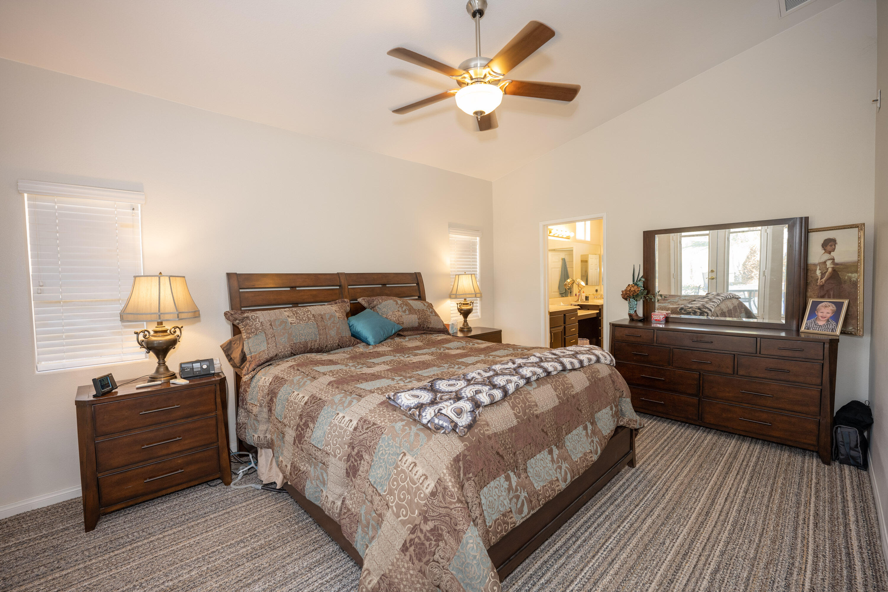 79754 Carmel Valley Avenue Indio, CA 92201 - Photo 7 of 36 a bedroom with a bed and wooden floor