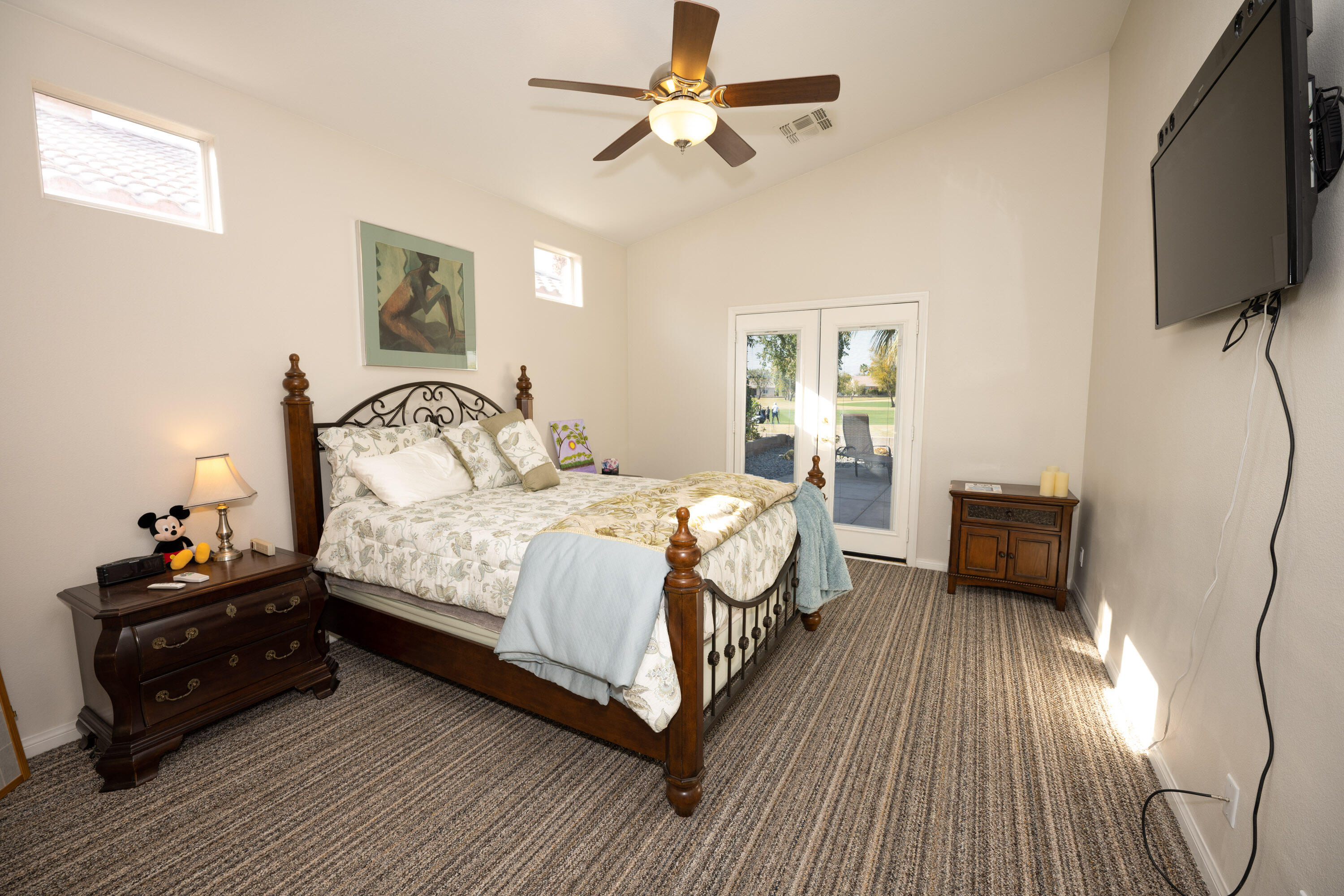 79754 Carmel Valley Avenue Indio, CA 92201 - Photo 10 of 36 a bedroom with a bed and a flat tv screen on dresser