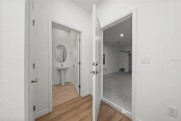 a bathroom with a glass shower door