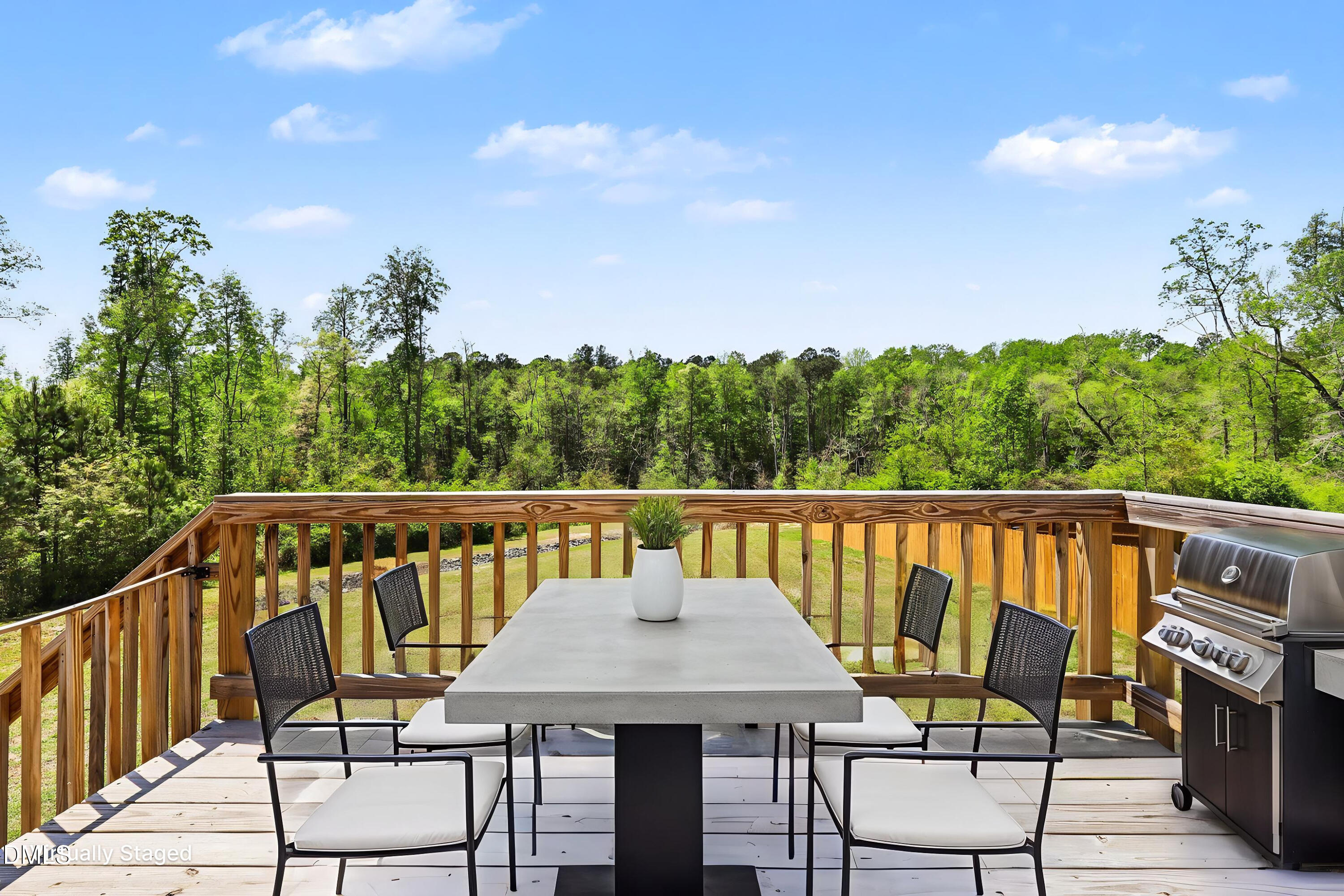 90 Rigsby Avenue Four Oaks, NC 27524 - Photo 1 of 43 a view of a chairs and table on the deck
