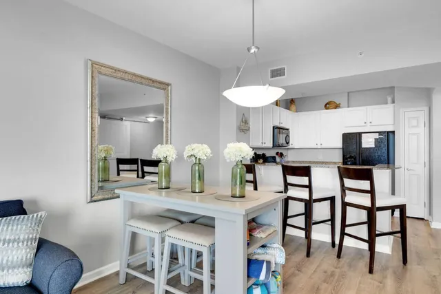a kitchen with granite countertop a sink and a stove