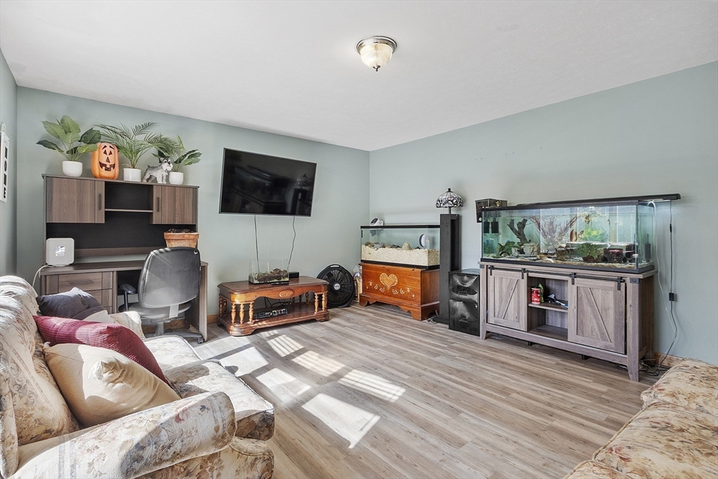 28 Old County Road Ashburnham, MA 01430 - Photo 5 of 30 a living room with furniture and a flat screen tv