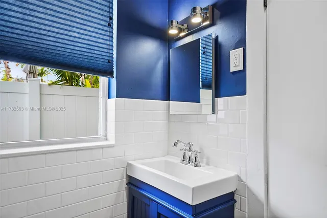 a spacious bedroom with a bed and wooden floor