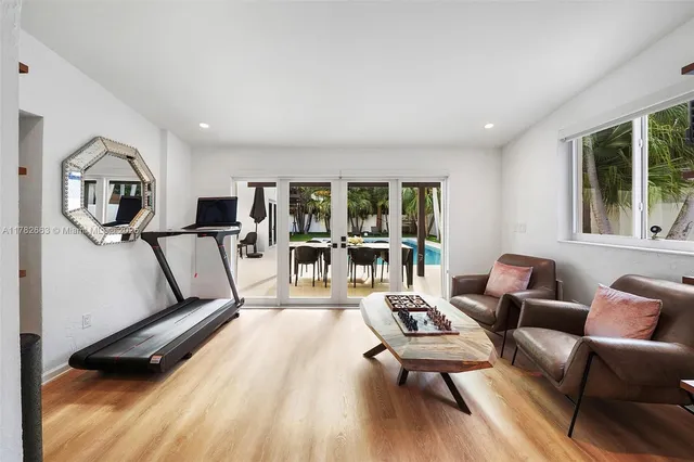 a bathroom with a sink a mirror and a shower