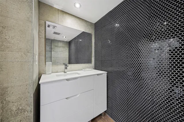 a spacious bedroom with a bed and a couch