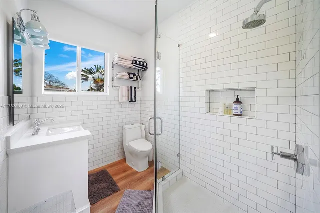 a view of a house with swimming pool and sitting area