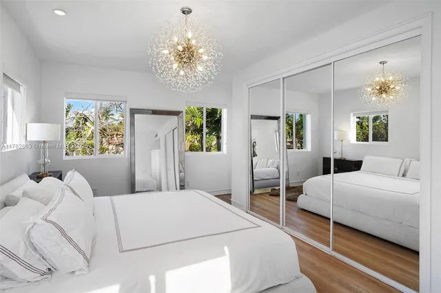 a view of an house with backyard and porch