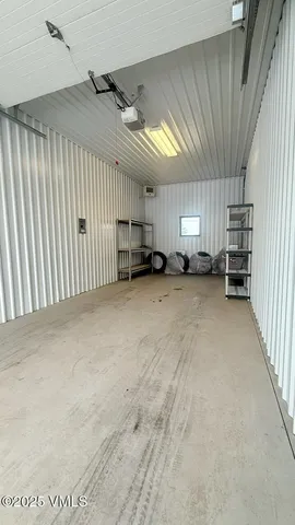 a view of a livingroom with furniture and a window