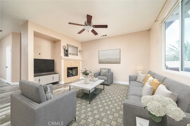 a living room with furniture fireplace and a flat screen tv