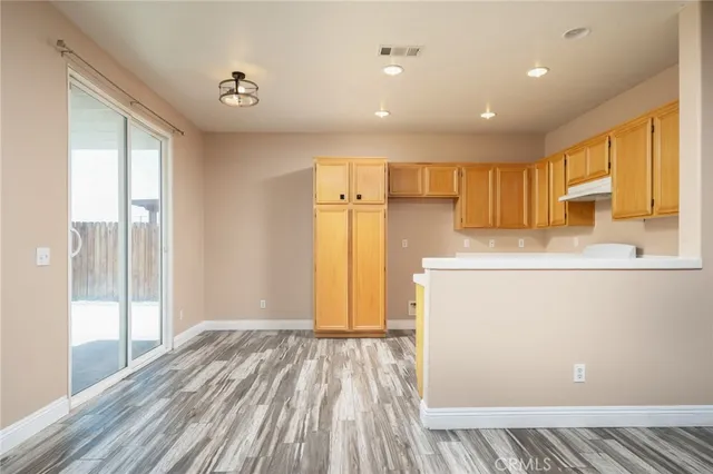 a view of a livingroom with wooden floor